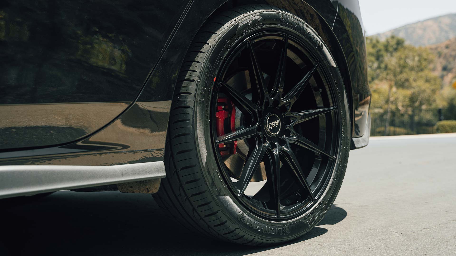 Image of a black Volkswagen GTI with Lionhart Tires