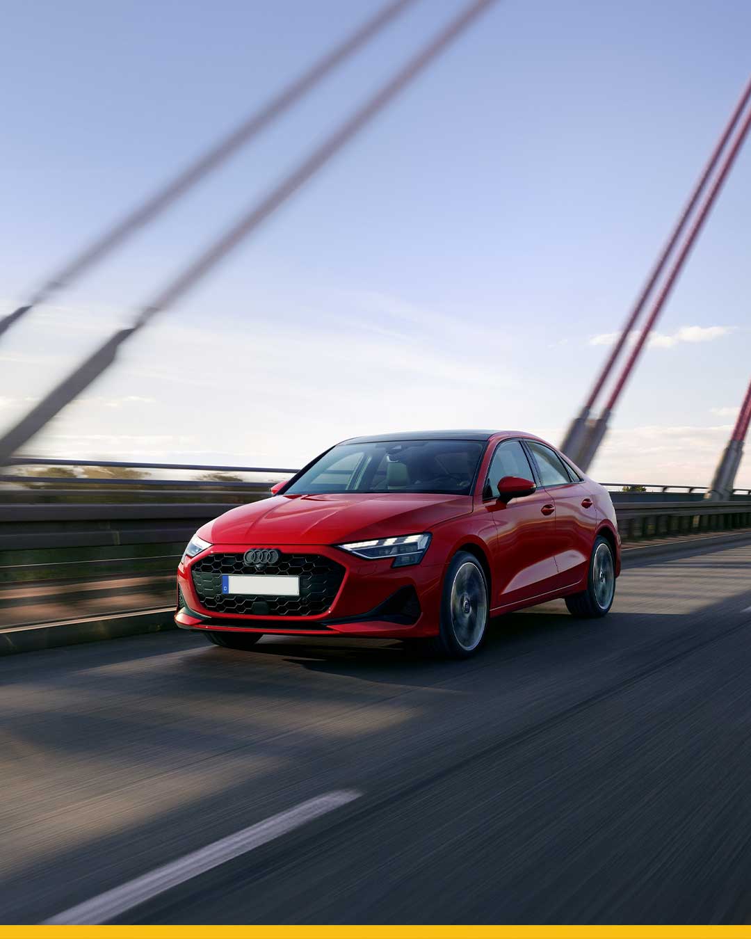 red audi a3 8y driving on bridge