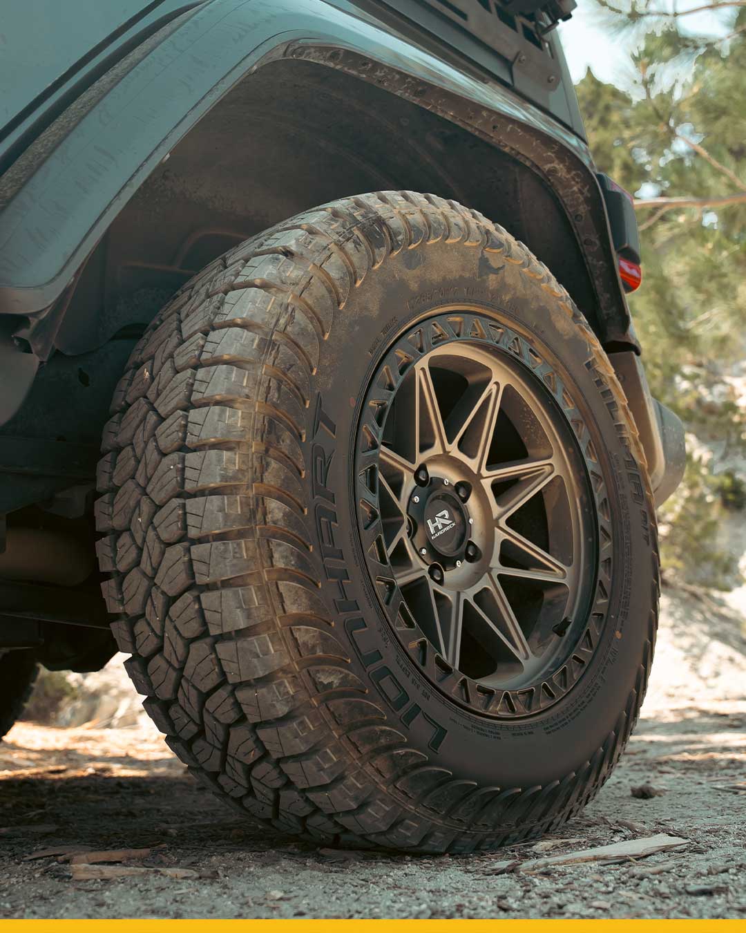 low angle detail shot of new lionhart kilima all terrain tire on jeep