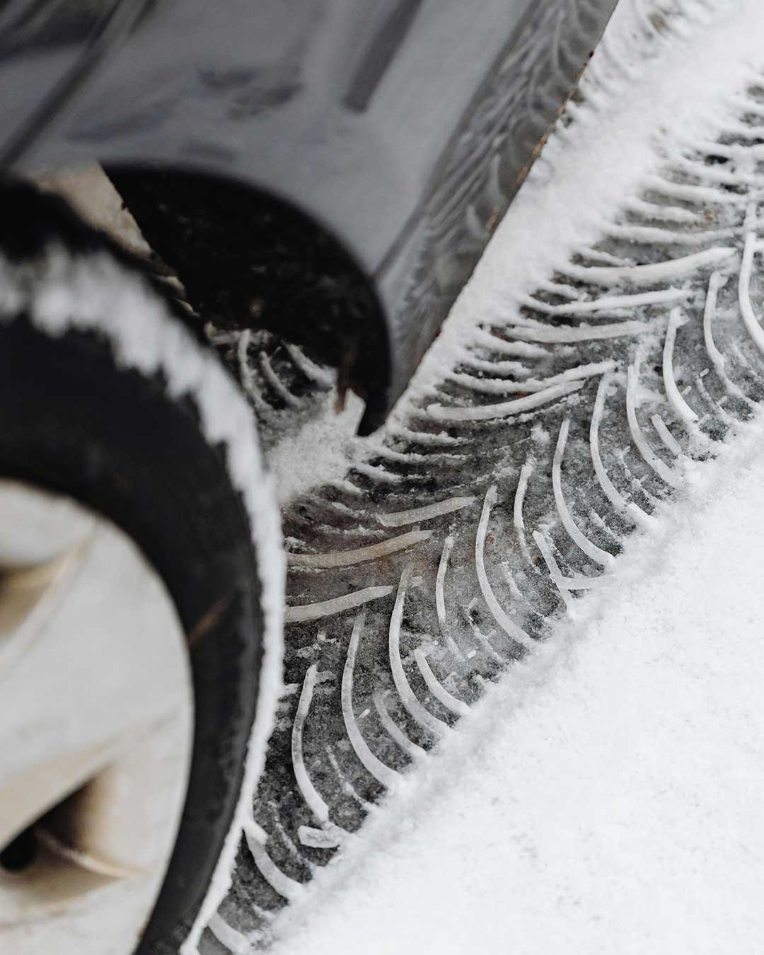 winter tire tread marks in snow